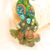 Prendedor pavo real